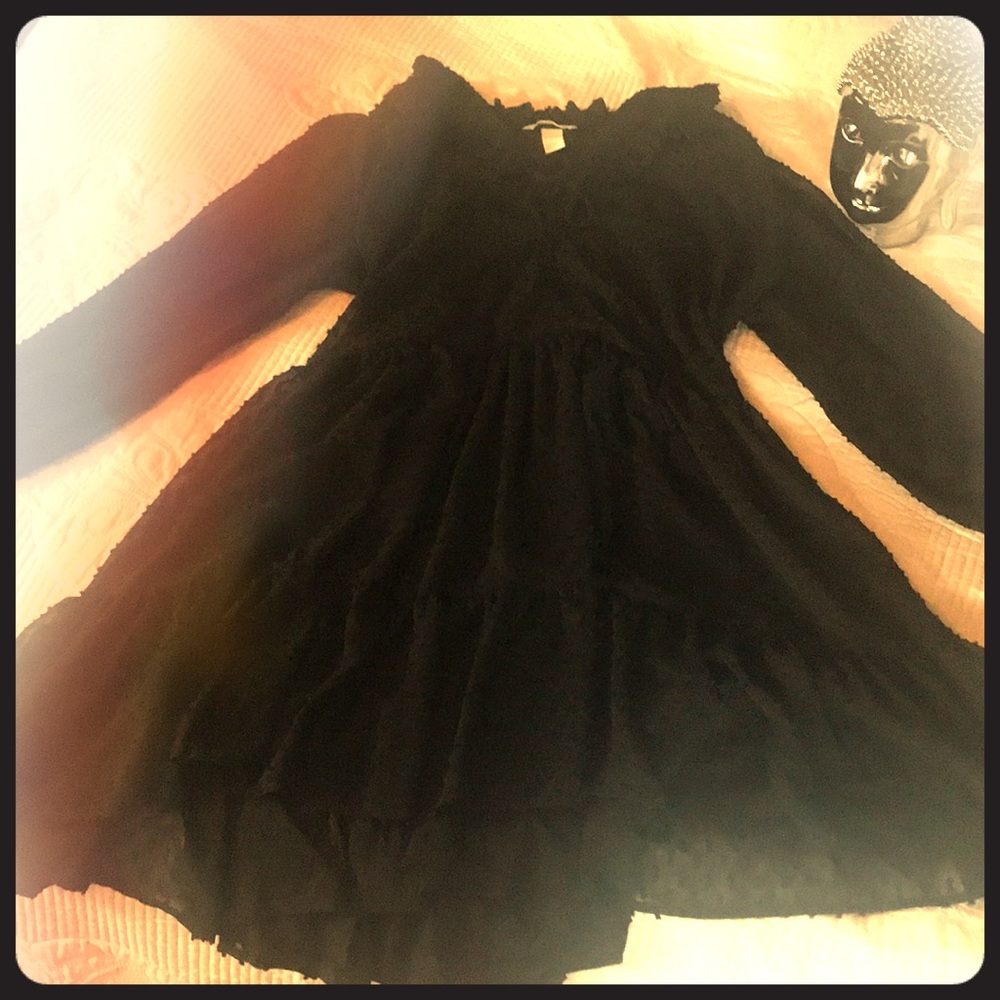 Short shear ruffled black dress with lining.